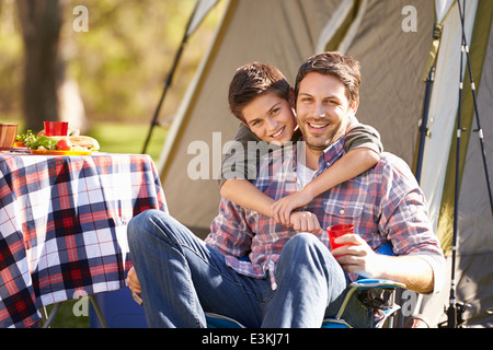 Father And Son Enjoying Camping Holiday In Countryside Stock Photo