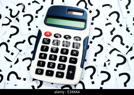 Hand calculator on question mark background Stock Photo