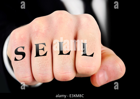 Sell word on business man fist Stock Photo