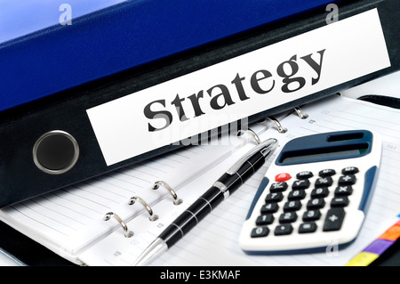 Strategy folder with office tools Stock Photo