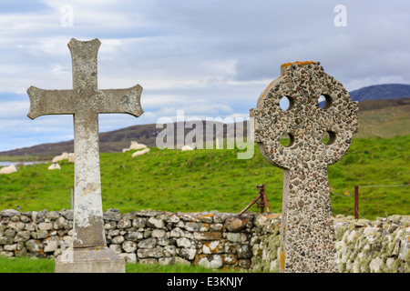 Howmore Chapel with Crucifix and Celtic cross in burial ground on South Uist Outer Hebrides Western Isles Scotland UK Britain Stock Photo