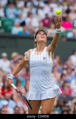 London, UK. 24th June, 2014. Wimbledon Tennis Championships Anna Tatishvili of United States serves towards Serena Williams of United States during day two ladies singles first round match at the Wimbledon Tennis Championships at The All England Lawn Tennis Club in London, United Kingdom. Credit:  Action Plus Sports/Alamy Live News Stock Photo