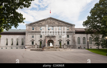 A Photo at Rideau Hall Main Entrance. A pair of tourists photograph outside the front of Rideau hall. Stock Photo