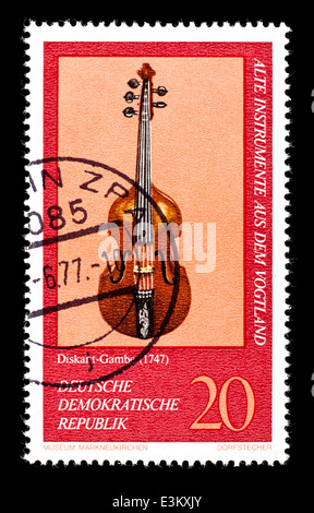 Postage stamp from East Germany (DDR) depicting a violin from Germany, in the Markneukirchen Music Museum. Stock Photo