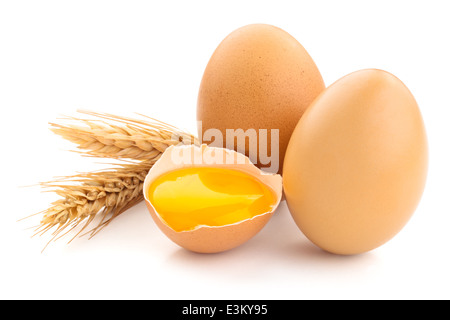 Wheat and brown eggs. Isolated on white . Studio shot. Stock Photo