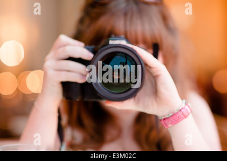 Picture of girl (10-12) using camera Stock Photo