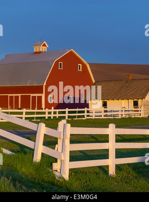 The Palouse, Whitman County, Washington: Red barn and farm scene in evening light