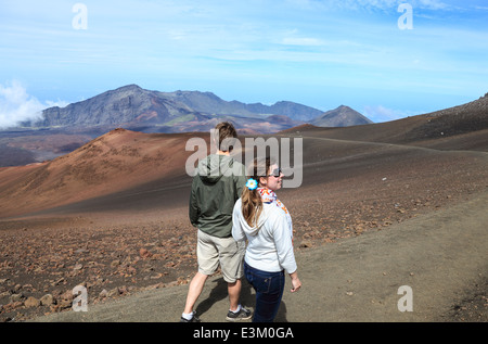 Couple on the Sliding Sands Trail at Haleakala National Park on Maui Stock Photo