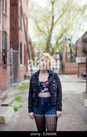 Portrait of young woman wearing denim jacket, Massachusetts, USA Stock Photo