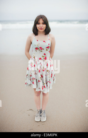 Portrait of young woman standing on beach, New Hampshire, USA Stock Photo