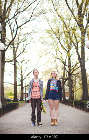 Portrait of two friends standing in park, Massachusetts, USA Stock Photo