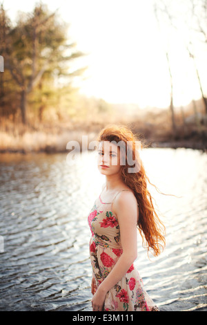 Young woman (18-19) standing in shallow water