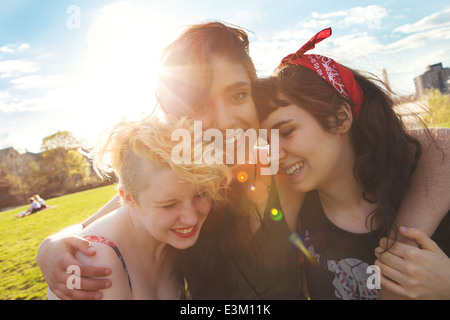 Three female friends laughing Stock Photo