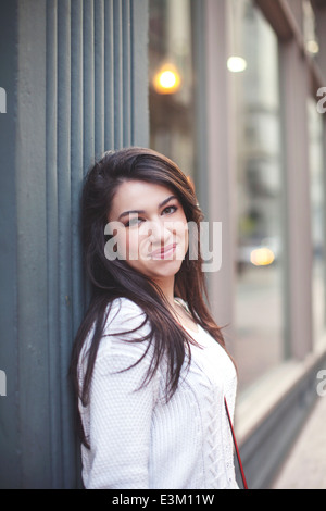 Portrait of young woman (18-19) smiling Stock Photo