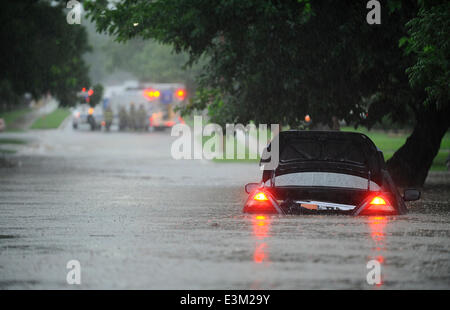 Ft. Worth, Tx, USA. 24th June, 2014. 6/24/2014. Ft. Worth firefighters block the intersection of Western Ave. and Bryce after thunder storms and heavy rains hit north Texas causing flash flooding in the Arlington Heights neighborhood in Ft. Worth Tx. Credit:  Ralph Lauer/ZUMAPRESS.com/Alamy Live News Stock Photo