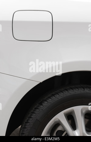 tyre and petrol cap cover of a white car Stock Photo