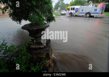 Ft. Worth, Tx, USA. 24th June, 2014. 6/24/2014. Ft. Worth firefighters block the intersection of Western Ave. and Bryce after thunder storms and heavy rains hit north Texas causing flash flooding in the Arlington Heights neighborhood in Ft. Worth Tx. Credit:  Ralph Lauer/ZUMAPRESS.com/Alamy Live News Stock Photo