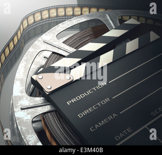 Clapperboard with rolls of film in the retro concept cinema. Stock Photo