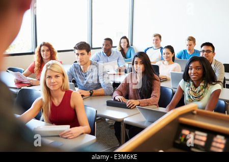 University Students Using Digital Tablet And Laptop In Class Stock Photo