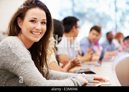 Class Of University Students Using Laptops In Lecture Stock Photo