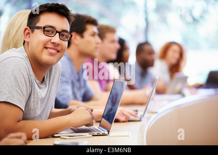 Class Of University Students Using Laptops In Lecture Stock Photo