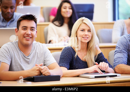 Students Using Laptops And Digital Tablets In Lecture Stock Photo