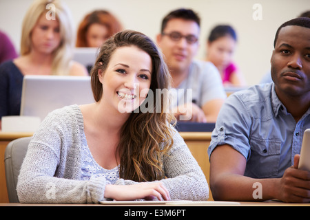 Female University Student Using Digital Tablet In Lecture Stock Photo