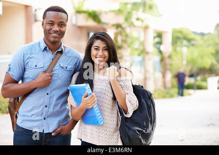 Male And Female University Students Outdoors On Campus Stock Photo