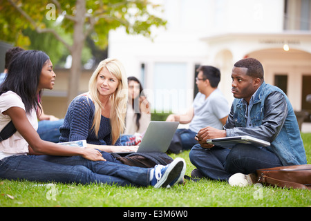 Group Of University Students Working Outside Together Stock Photo