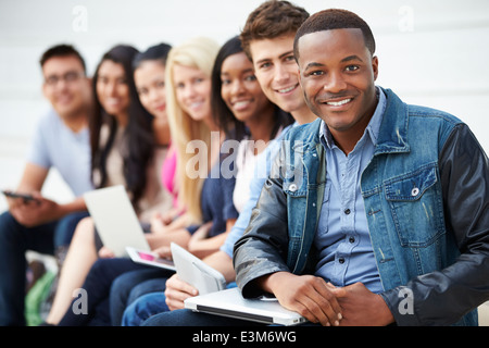 Portrait Of University Students Outdoors On Campus Stock Photo