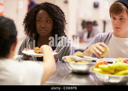 Kitchen Serving Food In Homeless Shelter Stock Photo