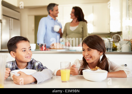 Hispanic Family Eating Breakfast At Home Together Stock Photo