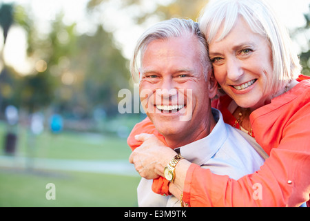 Outdoor Portrait Of Romantic Mature Couple In Park Stock Photo