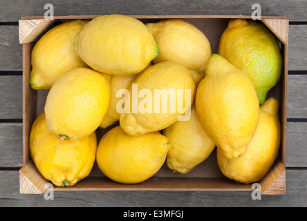 Wooden box of fresh lemons Stock Photo