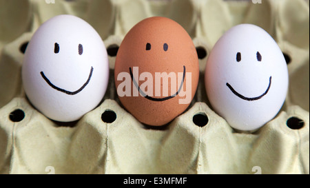 Three eggs with happy faces Stock Photo