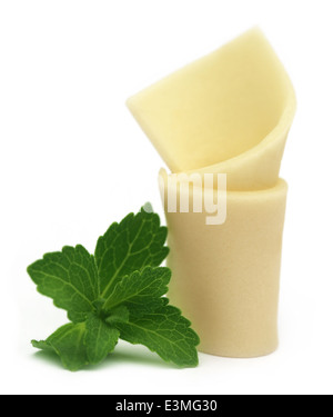 Chewing gum with green stevia over white background Stock Photo