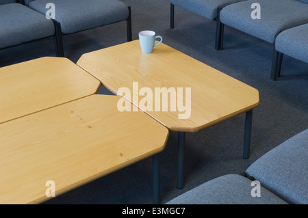 Mug on table in staff common room. Stock Photo