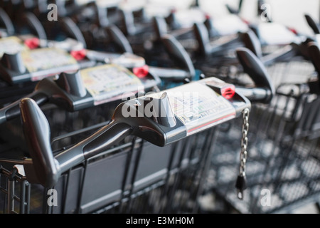 Shopping carts arranged in supermarket Stock Photo