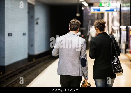 Rear view of business people waiting at subway station Stock Photo