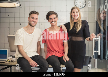 Portrait of confident new business team in creative office Stock Photo