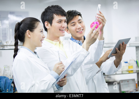 College students doing experiment Stock Photo