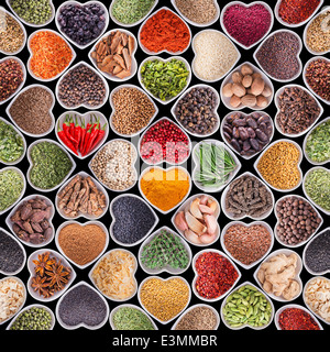 Seamless texture with spices and herbs over black background Stock Photo