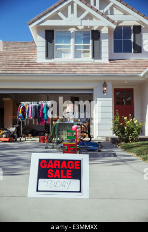 Garage Sale sign in driveway Stock Photo