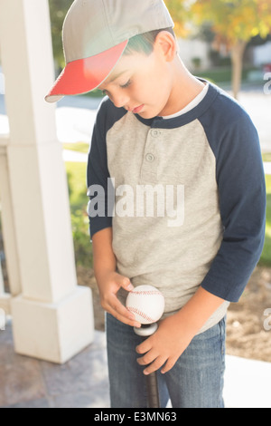 Boy with baseball and bat Stock Photo