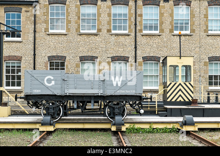 A historic Great Western railway truck on display outside Polaris House & the Steam museum in Swindon Wiltshire UK Stock Photo