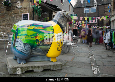 Skipton, Yorkshire Dales National Park, UK. 25th June, 2014. Bikes, Bunting and Window Art as Yorkshire prepares for Le Tour de France by decorating the route with yellow Bikes and Banners as Businesses gear up for the world's greatest cycle race - the Tour de France - which will start in the county on 5th & 6th July 2014 bringing millions of fans to the Yorkshire roadside to cheer on the champions of the sport.  It will be the first time Le Tour has visited the north of England having previously only made visits to the south coast and the capital. Credit:  Mar Photographics/Alamy Live News Stock Photo