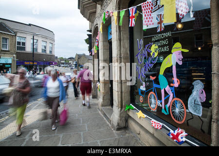 Skipton, Yorkshire Dales National Park, UK. 25th June 2014. Bikes, Bunting and Window Art as Yorkshire prepares for Le Tour de France by decorating the route with yellow Bikes and Banners as Businesses gear up for the world's greatest cycle race - the Tour de France - which will start in the county on 5th & 6th July 2014 bringing millions of fans to the Yorkshire roadside to cheer on the champions of the sport.  It will be the first time Le Tour has visited the north of England having previously only made visits to the south coast and the capital. Credit:  Mar Photographics/Alamy Live News Stock Photo