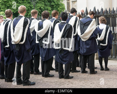 Cambridge, UK. 25th June 2014. Students from Trinity College (Cambridge, England)  in their academic gowns wait to enter Senate House for their graduation ceremony on 25 june 2014. Credit:  miscellany/Alamy Live News Stock Photo