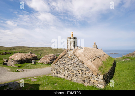 Restored thatched blackhouses crofts in Na Gearrannan Blackhouse Village museum on west coast. Garenin Carloway Isle of Lewis Outer Hebrides Scotland Stock Photo