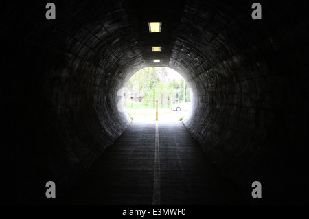 Light shining through a dark tunnel. Stock Photo